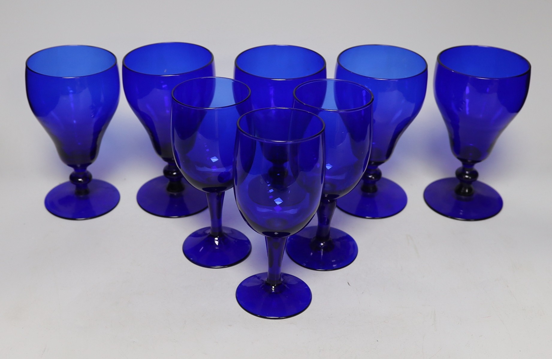 A set of five Bristol blue glasses and three others
